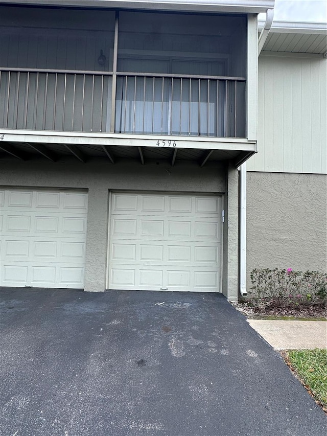 4596 Pheasant Run Dr Unit C, Orlando, FL 32808 - garage with driveway