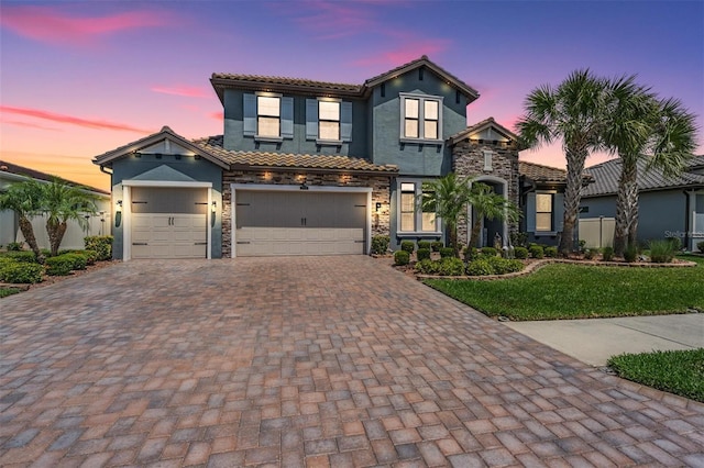 29043 Picana Ln, Wesley Chapel, FL 33543 - view of front of property featuring decorative driveway, a tiled roof, and stucco siding