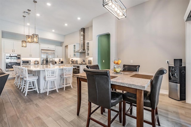 29043 Picana Ln, Wesley Chapel, FL 33543 - dining room featuring light wood finished floors and recessed lighting