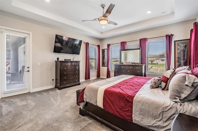 29043 Picana Ln, Wesley Chapel, FL 33543 - carpeted bedroom featuring a tray ceiling, access to outside, baseboards, recessed lighting, and ceiling fan