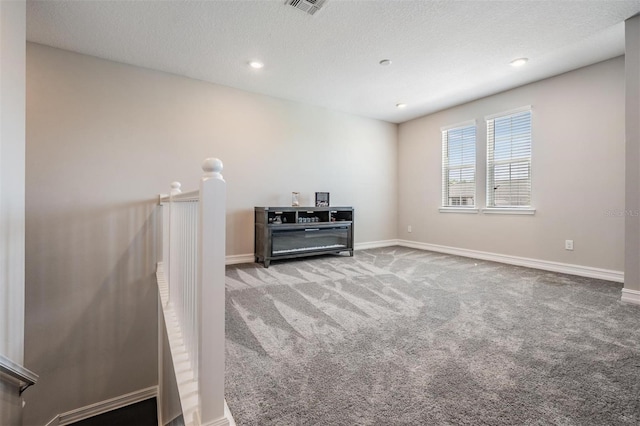 29043 Picana Ln, Wesley Chapel, FL 33543 - spare room featuring carpet, baseboards, a textured ceiling, and recessed lighting