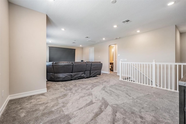 29043 Picana Ln, Wesley Chapel, FL 33543 - cinema room with arched walkways, carpet, baseboards, and recessed lighting