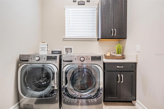 29043 Picana Ln, Wesley Chapel, FL 33543 - laundry area with washer and clothes dryer, cabinet space, and baseboards