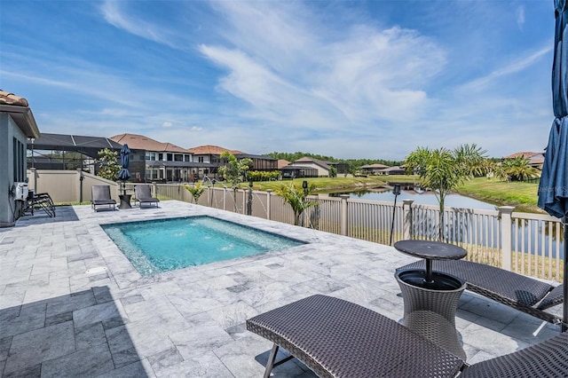 29043 Picana Ln, Wesley Chapel, FL 33543 - view of swimming pool with a patio area, a fenced backyard, a water view, and a residential view