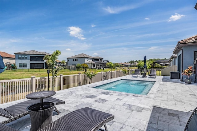 29043 Picana Ln, Wesley Chapel, FL 33543 - view of pool featuring a patio area, a residential view, a fenced backyard, and a jacuzzi