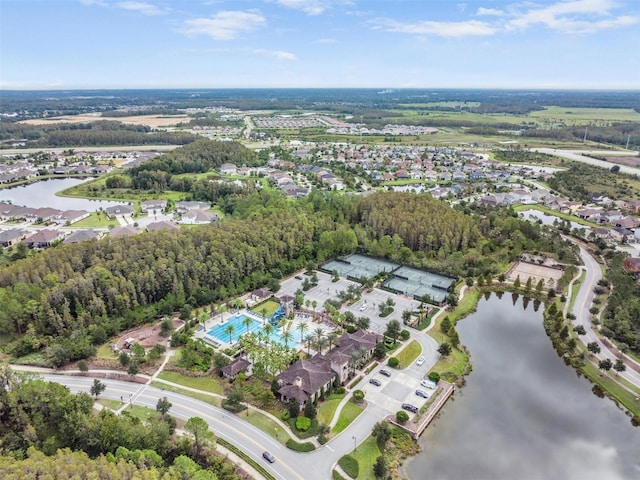29043 Picana Ln, Wesley Chapel, FL 33543 - aerial overview of property's location with a nearby body of water, a pool area, and nearby suburban area