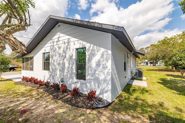 1403 Cummings Ave, Avon Park, FL 33825 - view of property exterior with cooling unit and a lawn