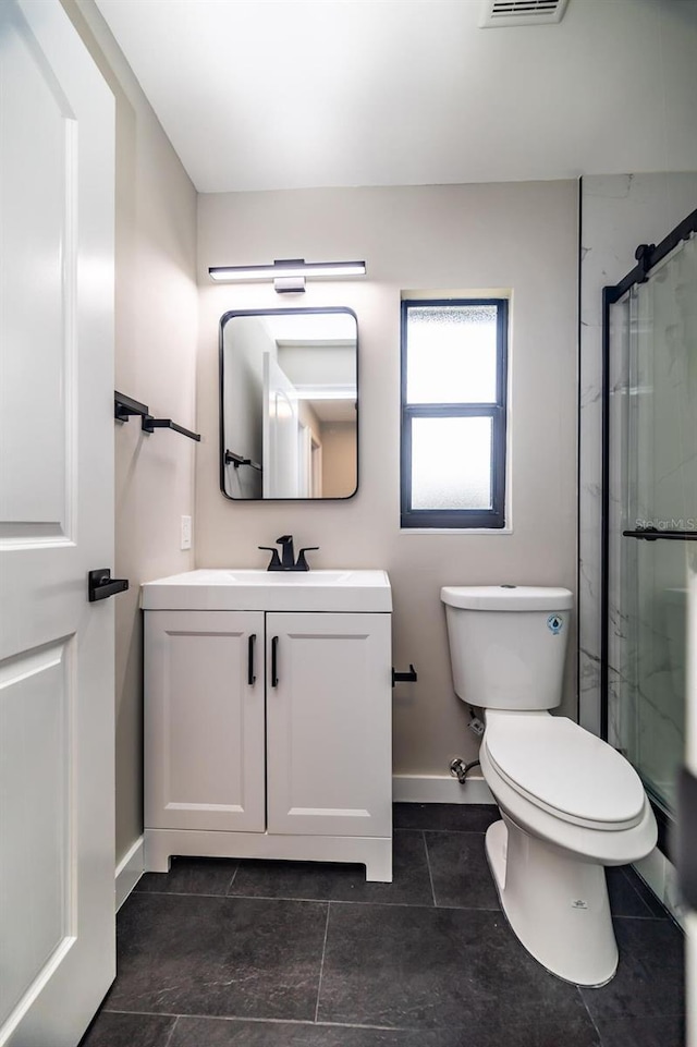 1403 Cummings Ave, Avon Park, FL 33825 - full bathroom with an enclosed shower, toilet, vanity, baseboards, and tile patterned flooring