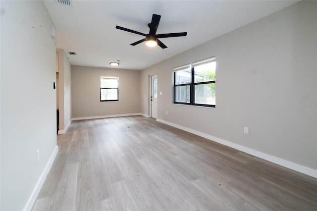 1403 Cummings Ave, Avon Park, FL 33825 - empty room with light wood-type flooring, baseboards, and a ceiling fan
