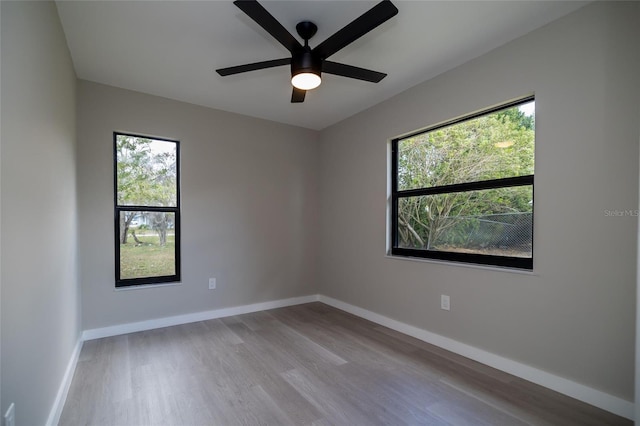 1403 Cummings Ave, Avon Park, FL 33825 - unfurnished room featuring wood finished floors, baseboards, and ceiling fan