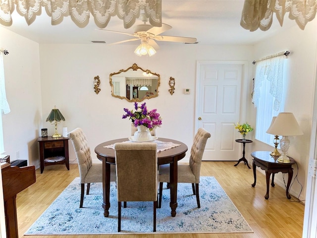 204 Holland St, Lake Wales, FL 33859 - dining area featuring ceiling fan and light wood-style flooring