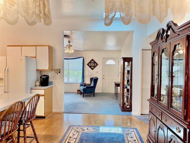 204 Holland St, Lake Wales, FL 33859 - entrance foyer with light wood-style flooring, ceiling fan, and baseboards