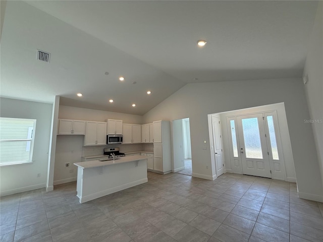 931 Azalea Walk Cir, Deland, FL 32724 - kitchen featuring appliances with stainless steel finishes, healthy amount of natural light, white cabinets, light countertops, and recessed lighting