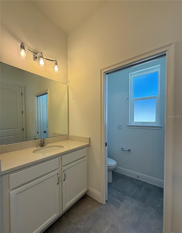 931 Azalea Walk Cir, Deland, FL 32724 - bathroom featuring vanity, baseboards, and toilet