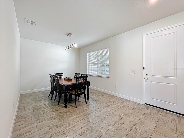 3184 Pinenut Dr, Apopka, FL 32712 - dining room with baseboards and wood tiled floors