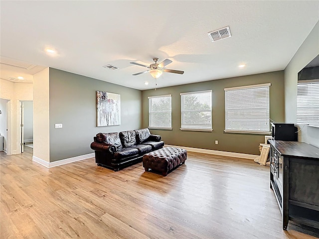3184 Pinenut Dr, Apopka, FL 32712 - living room featuring a ceiling fan, light wood finished floors, baseboards, and recessed lighting