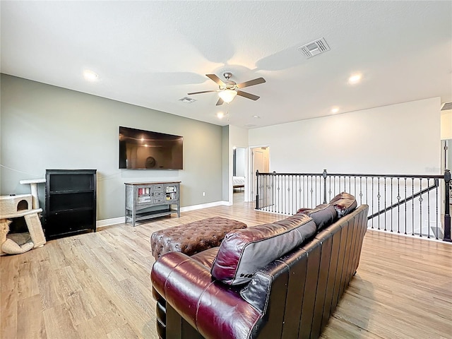 3184 Pinenut Dr, Apopka, FL 32712 - living room with a ceiling fan, light wood-style floors, baseboards, and recessed lighting