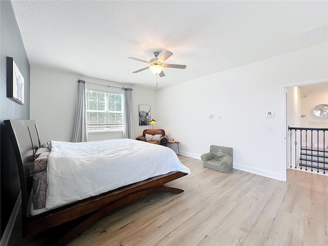 3184 Pinenut Dr, Apopka, FL 32712 - bedroom featuring light wood-style flooring, baseboards, and a ceiling fan