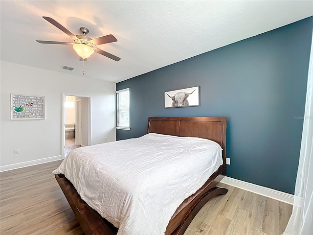 3184 Pinenut Dr, Apopka, FL 32712 - bedroom featuring light wood finished floors, baseboards, and a ceiling fan