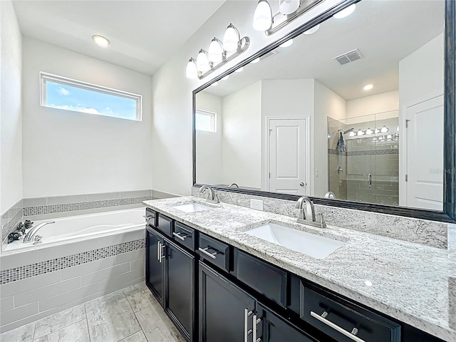 3184 Pinenut Dr, Apopka, FL 32712 - bathroom featuring a bath, a stall shower, and double vanity