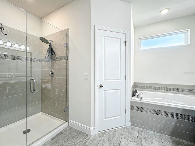 3184 Pinenut Dr, Apopka, FL 32712 - full bath featuring a stall shower, a bath, and wood finished floors