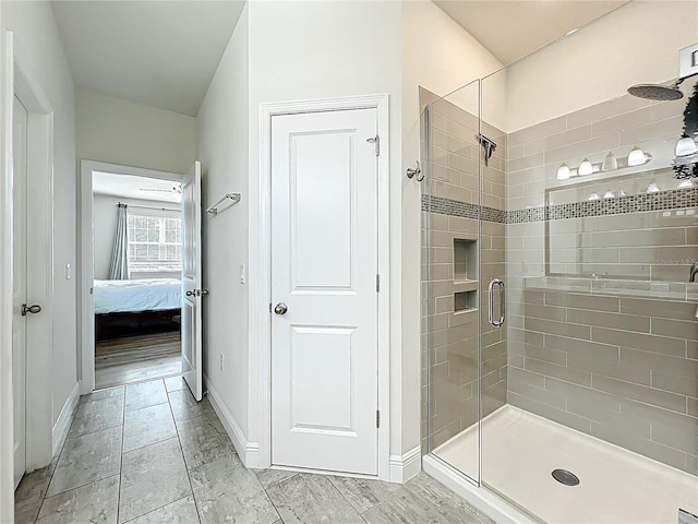 3184 Pinenut Dr, Apopka, FL 32712 - full bathroom with a stall shower, connected bathroom, and baseboards