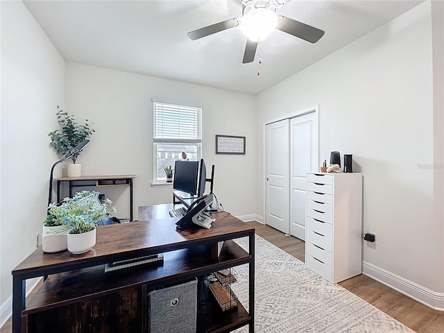 3184 Pinenut Dr, Apopka, FL 32712 - home office featuring baseboards, light wood-style floors, and a ceiling fan