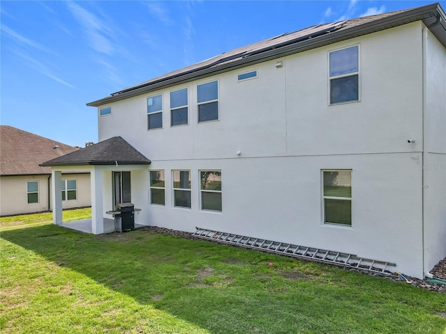 3184 Pinenut Dr, Apopka, FL 32712 - back of property featuring a yard and stucco siding
