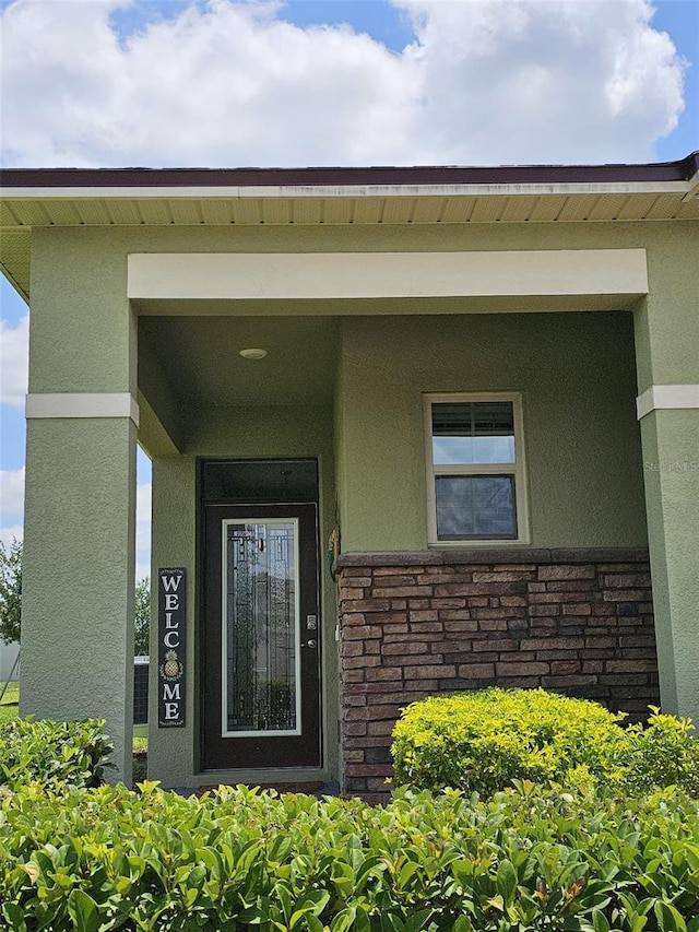 3371 Yellowtop Loop, Clermont, FL 34714 - entrance to property with stucco siding and stone siding