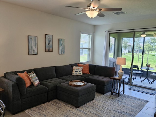3371 Yellowtop Loop, Clermont, FL 34714 - living area with a ceiling fan and tile patterned flooring