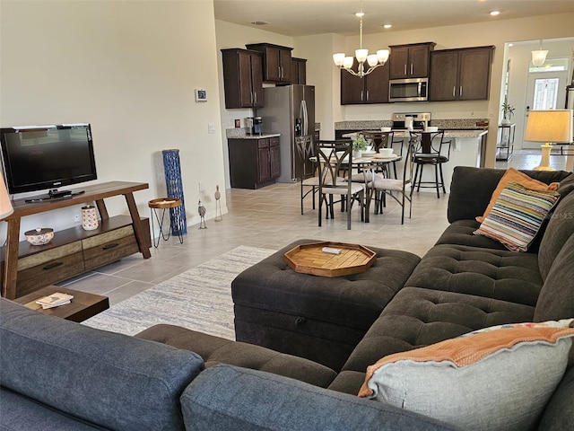3371 Yellowtop Loop, Clermont, FL 34714 - living room featuring a chandelier, light tile patterned flooring, and recessed lighting