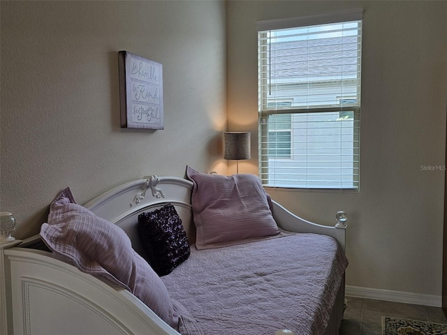 3371 Yellowtop Loop, Clermont, FL 34714 - tiled bedroom featuring baseboards