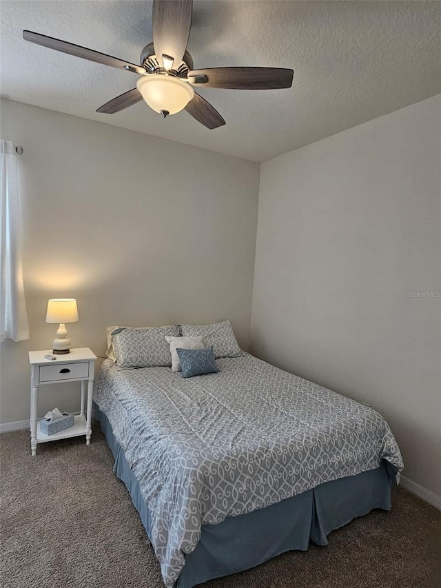 3371 Yellowtop Loop, Clermont, FL 34714 - bedroom with carpet flooring, baseboards, a ceiling fan, and a textured ceiling