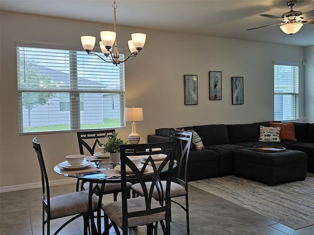 3371 Yellowtop Loop, Clermont, FL 34714 - dining room featuring a chandelier, tile patterned floors, baseboards, and ceiling fan