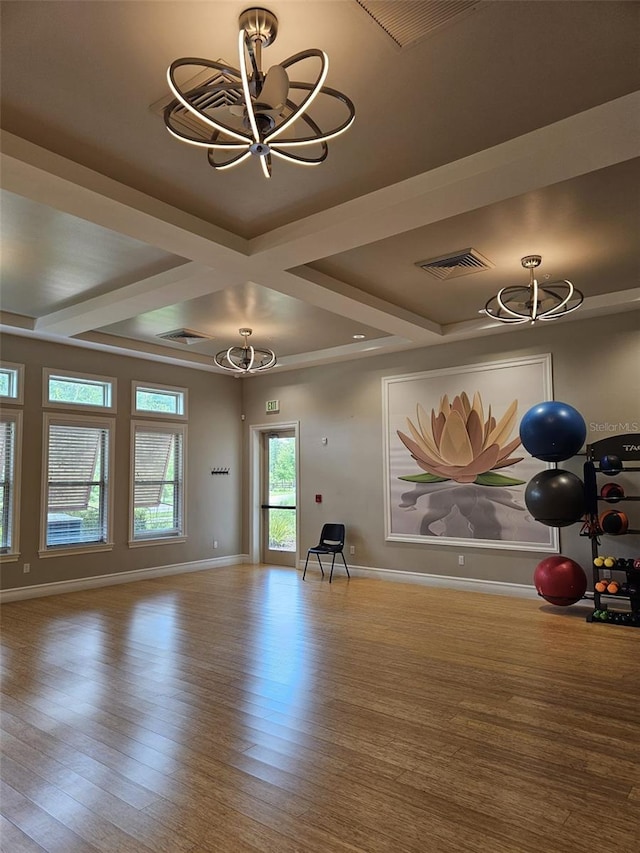 3371 Yellowtop Loop, Clermont, FL 34714 - workout area with a chandelier, wood finished floors, baseboards, and coffered ceiling
