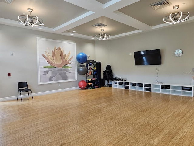 3371 Yellowtop Loop, Clermont, FL 34714 - exercise room with a chandelier, coffered ceiling, wood finished floors, and baseboards