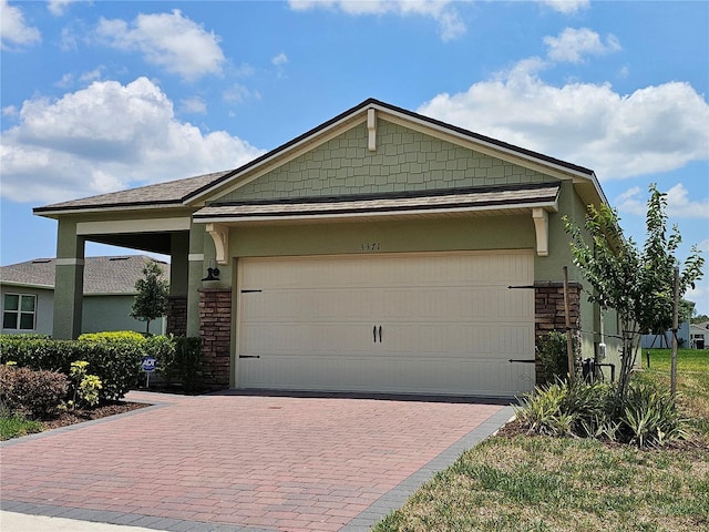 3371 Yellowtop Loop, Clermont, FL 34714 - view of front of house featuring decorative driveway and an attached garage