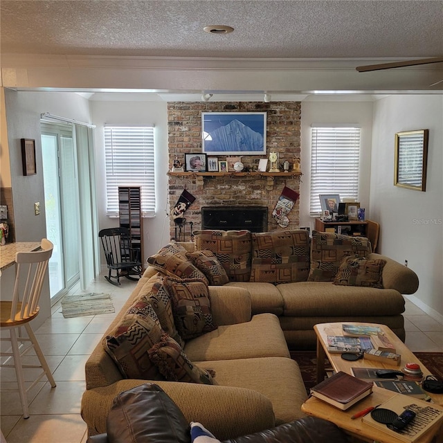 8539 Clematis Ln, Orlando, FL 32819 - living area featuring a textured ceiling, healthy amount of natural light, light tile patterned floors, and a brick fireplace