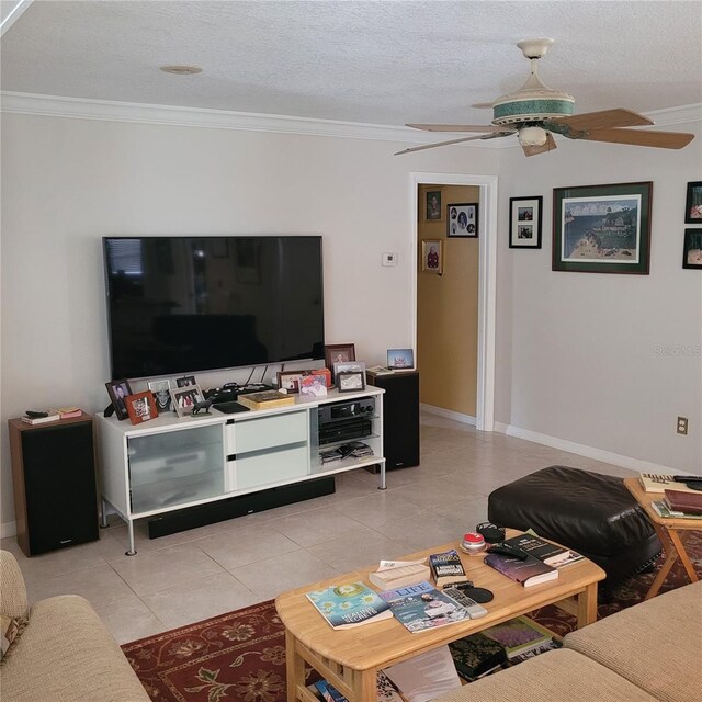 8539 Clematis Ln, Orlando, FL 32819 - living area with ornamental molding, light tile patterned floors, a ceiling fan, a textured ceiling, and baseboards