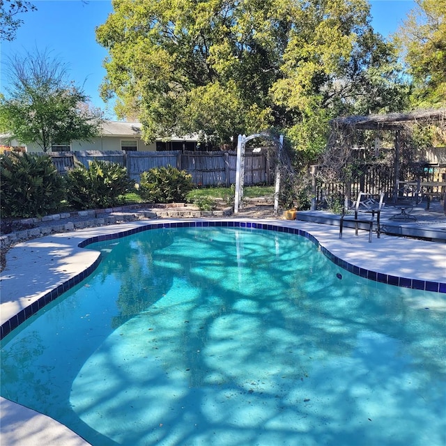 8539 Clematis Ln, Orlando, FL 32819 - view of swimming pool with a wooden deck