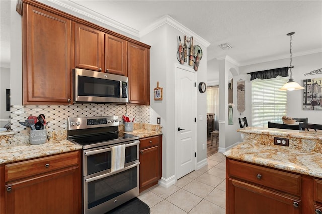 7003 Cupseed Ln, Harmony, FL 34773 - kitchen featuring stainless steel appliances, backsplash, light tile patterned floors, decorative light fixtures, and light stone countertops