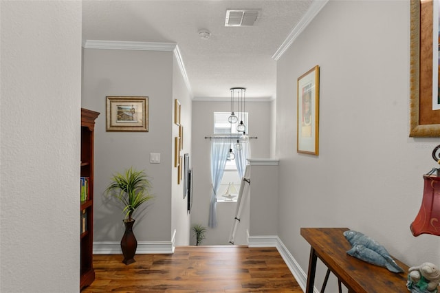 7003 Cupseed Ln, Harmony, FL 34773 - foyer with wood finished floors, crown molding, baseboards, and a textured ceiling