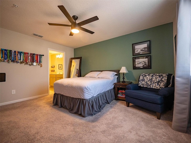 391 Cape Honeysuckle Pl, Sanford, FL 32771 - carpeted bedroom with ensuite bathroom, baseboards, and ceiling fan