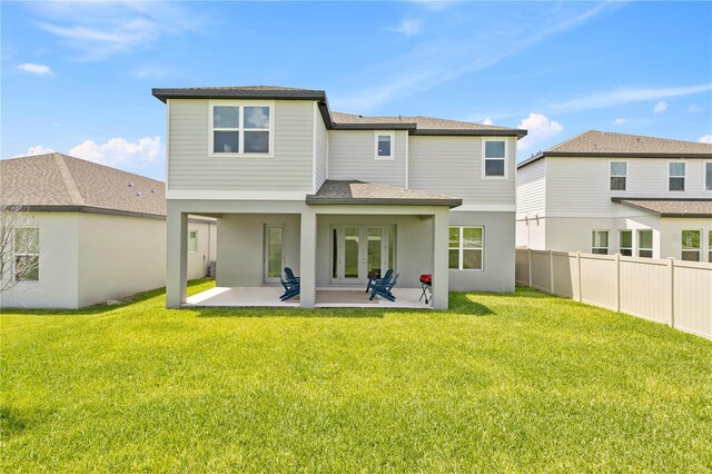 16013 Silver Brook Way, Winter Garden, FL 34787 - rear view of house featuring a patio, french doors, a shingled roof, and stucco siding