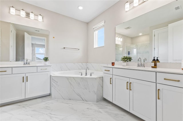 16013 Silver Brook Way, Winter Garden, FL 34787 - bathroom featuring a marble finish shower, a garden tub, marble look tiles, and two vanities