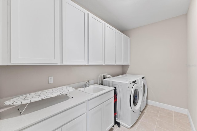 16013 Silver Brook Way, Winter Garden, FL 34787 - laundry room featuring cabinet space, washer and clothes dryer, baseboards, and light tile patterned flooring