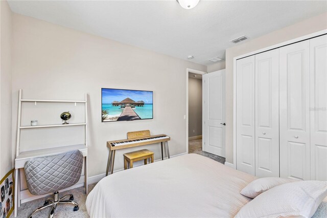16013 Silver Brook Way, Winter Garden, FL 34787 - bedroom with baseboards, a closet, and carpet