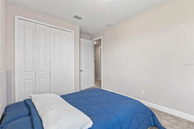 16013 Silver Brook Way, Winter Garden, FL 34787 - bedroom with carpet, baseboards, and a closet