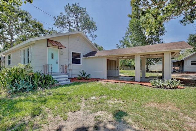222 E Atwater Ave, Eustis, FL 32726 - view of front of property featuring a front lawn and an attached carport