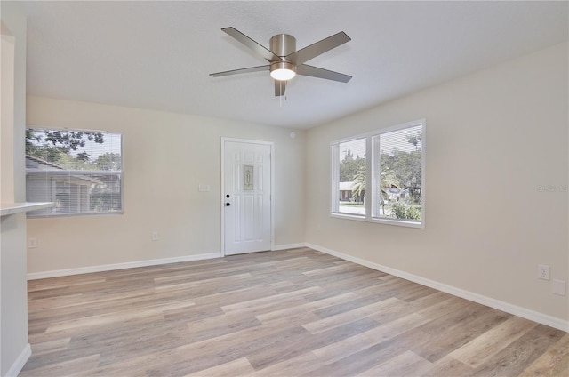 222 E Atwater Ave, Eustis, FL 32726 - unfurnished room with a ceiling fan, light wood-type flooring, and baseboards